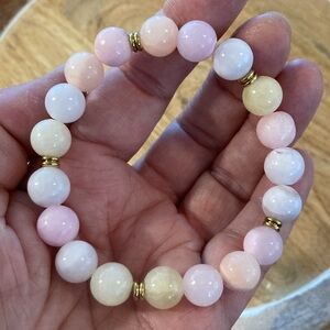 Pink rose stone bracelet with goldtone separators stretchy pink yellow white